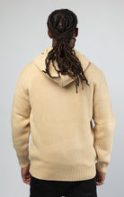 back of A stylish and comfortable Knitted Jersey Hooded Sweater in sand color, featuring a relaxed fit, a hood, and luxuriously soft knitted jersey fabric.