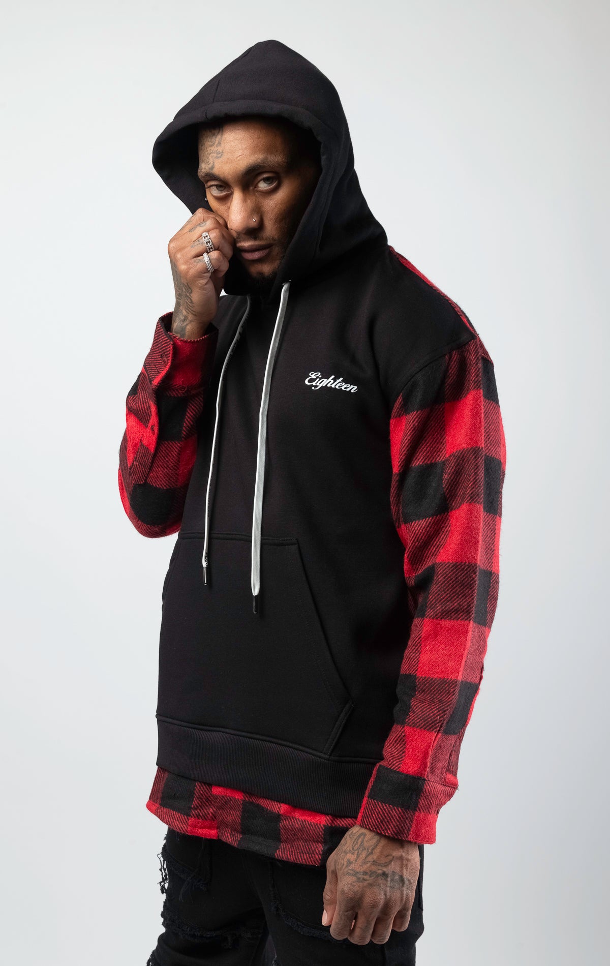 Pullover hooded sweatshirt with plaid pattern on back and sleeves.