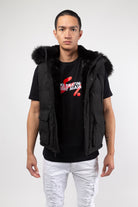 Black Faux fur-lined hooded jacket made of a water-resistant polyester shell featuring a removable hood with a removable faux fox fur trim. The hood and front of the jacket are lined with faux rabbit fur for superior warmth. The jacket has JC branded zippers throughout, dual pockets at the sides with button openings, and a full zipper front opening. Faux suede taping adorns the front zipper.