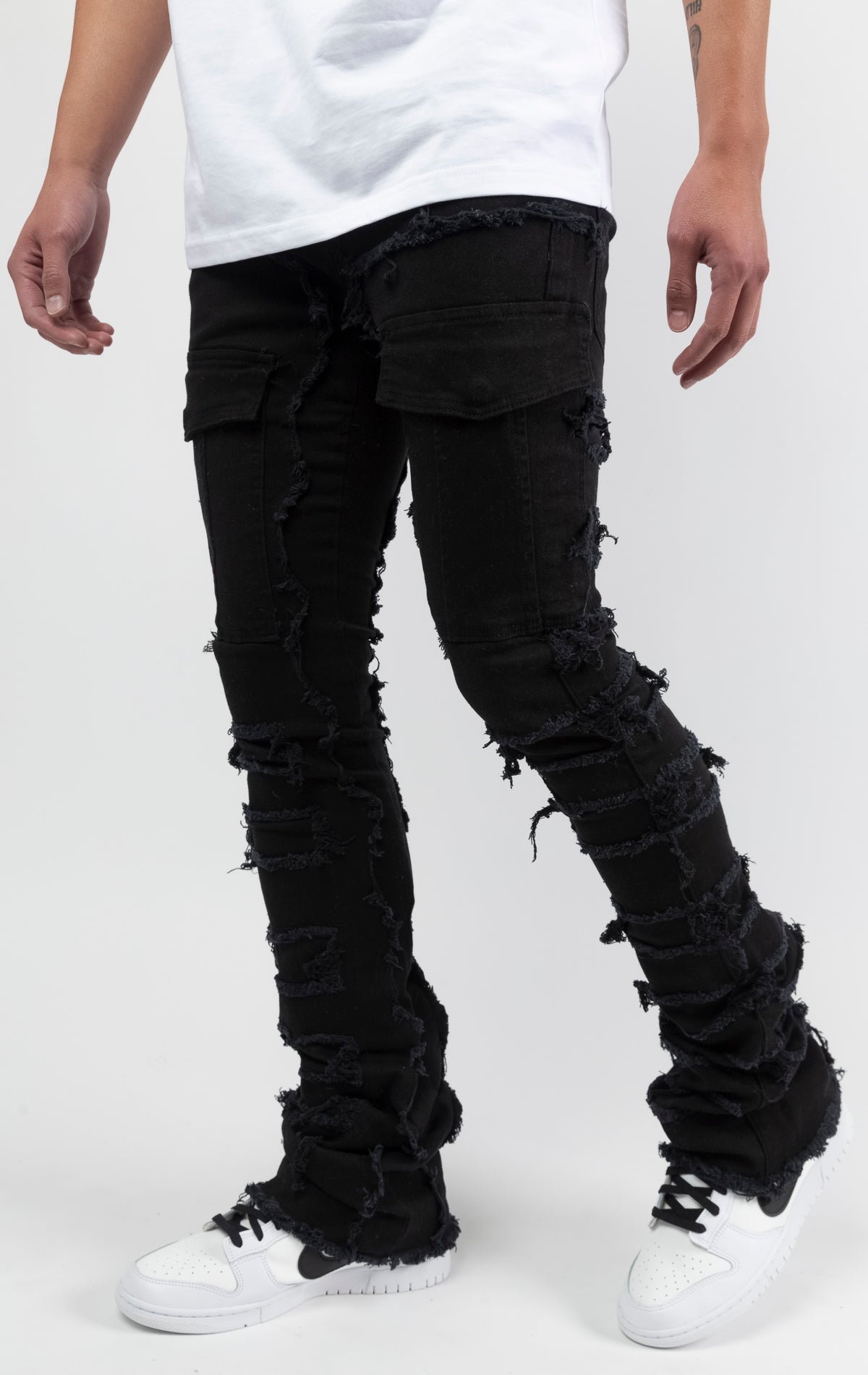Black Fray panel with stitch design, stacked cargo jeans with classic 5 pockets and flared bottom leg.