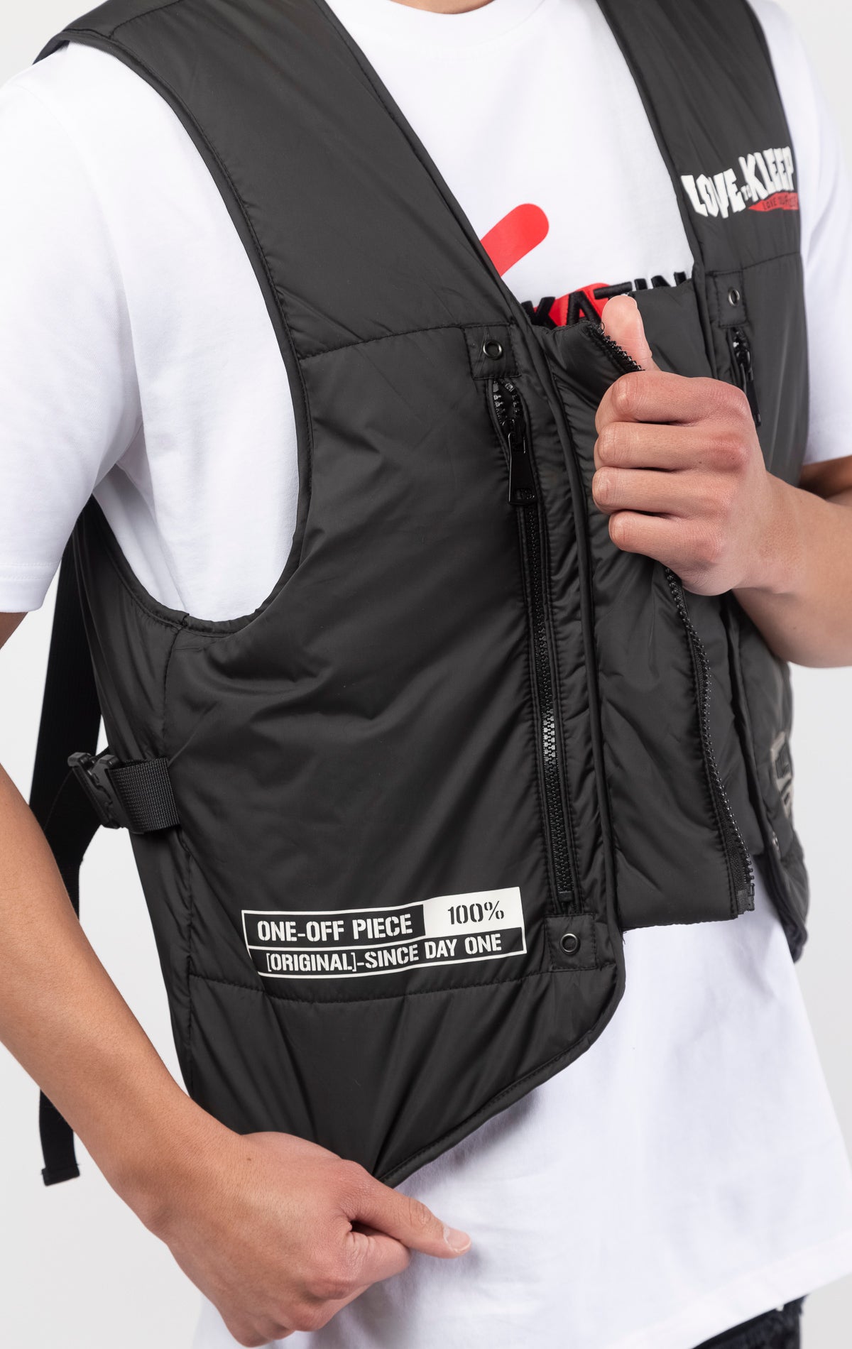 Black Premium Cire Padded Vest with 2oz of padding, adjustable straps, and functional front and back pockets. Back features a PHRESH(FRESH) screen print, while the front showcases a Love to Kleep logo and clear rubber patch.
