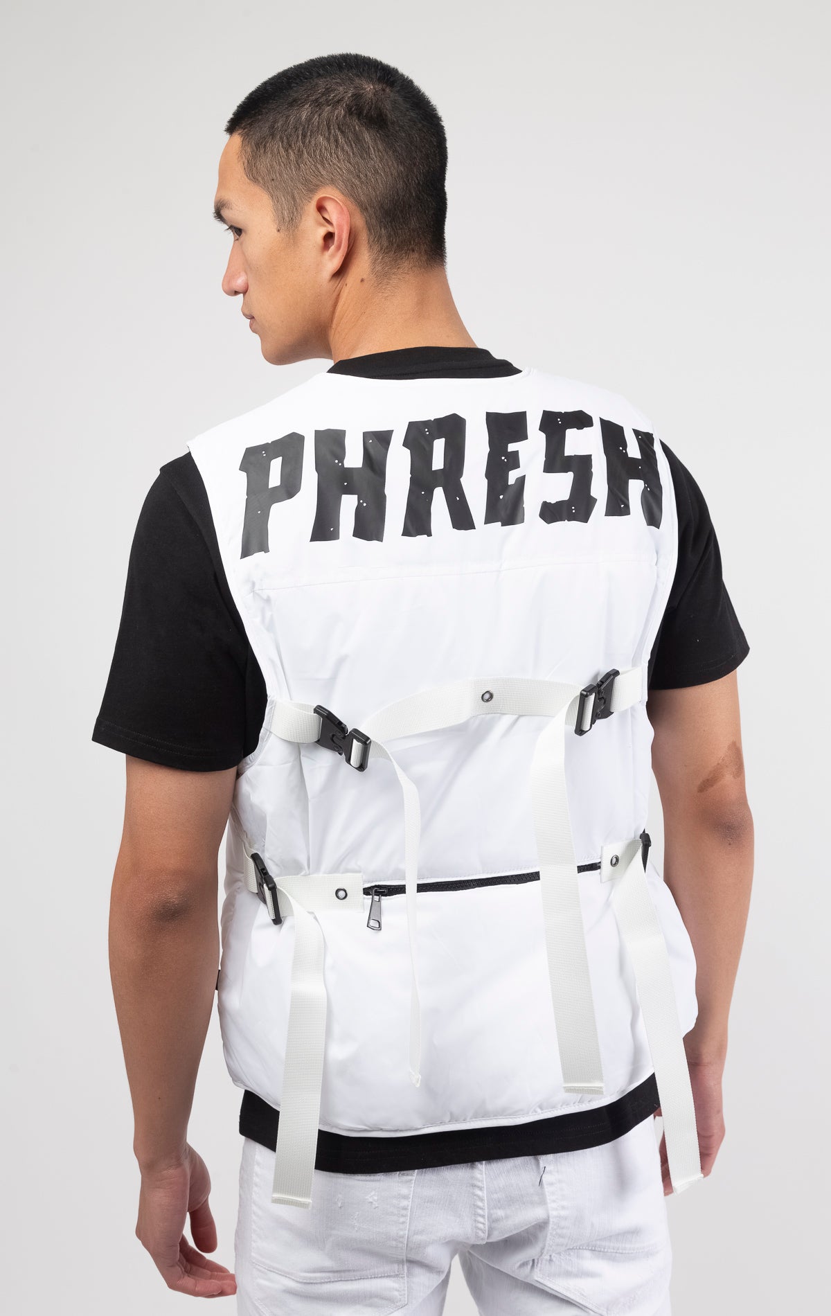 White Premium Cire Padded Vest with 2oz of padding, adjustable straps, and functional front and back pockets. Back features a PHRESH(FRESH) screen print, while the front showcases a Love to Kleep logo and clear rubber patch.