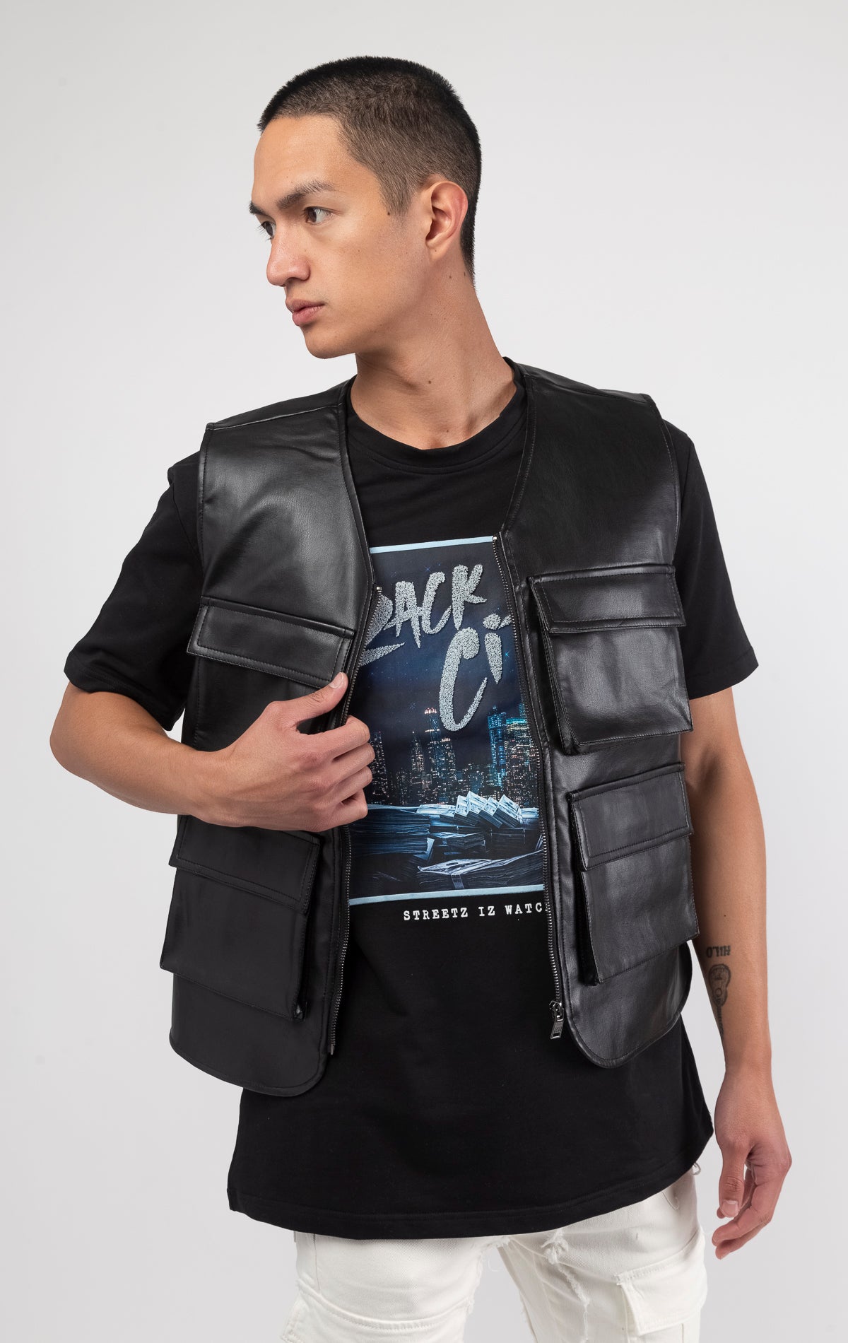 Black faux leather cargo vest crafted from 100% PU, durable and cruelty-free. Featuring a 100% Polyester Linin.