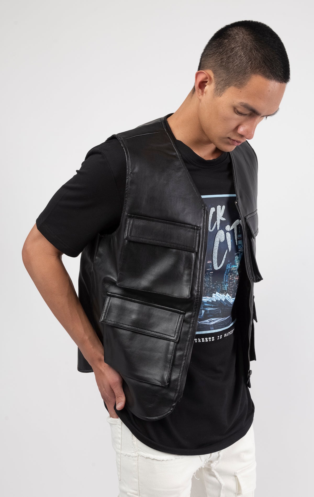 Black faux leather cargo vest crafted from 100% PU, durable and cruelty-free. Featuring a 100% Polyester Linin.