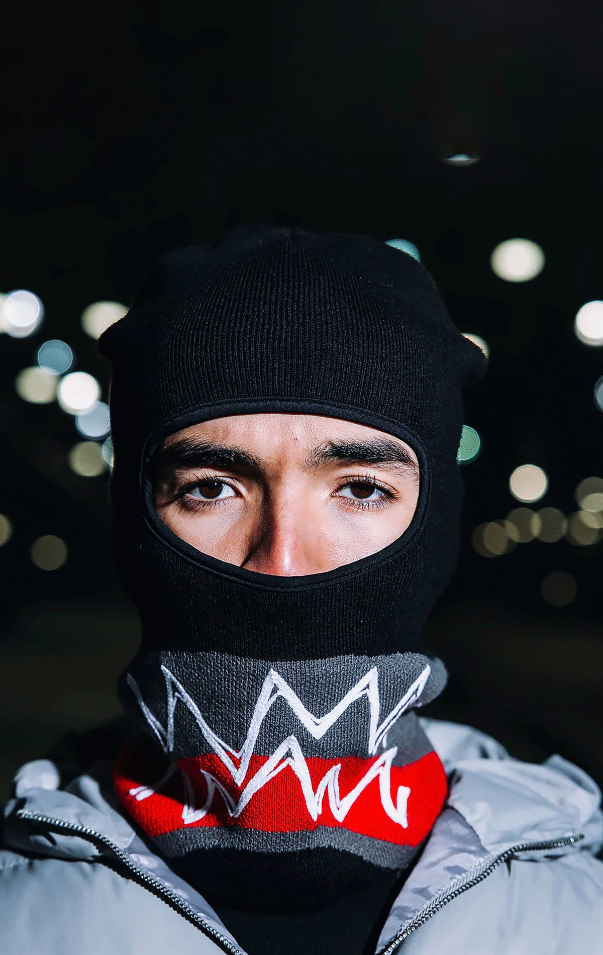 A stylish and warm limited-edition cozy ski mask featuring a soft and warm knitted construction, one-size-fits-all design, and perfect for winter outdoor activities.