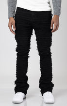 Black Men's mid-rise, non-stretch jeans in a dark wash with an extreme frayed logo design on the inseam. The jeans feature a stacked leg design, five pockets, belt loops, and a zipper fly with a top button closure. Made from 100% cotton.  