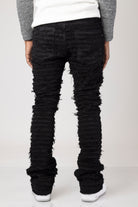 Black Men's mid-rise, non-stretch jeans in a dark wash with an extreme frayed logo design on the inseam. The jeans feature a stacked leg design, five pockets, belt loops, and a zipper fly with a top button closure. Made from 100% cotton.  