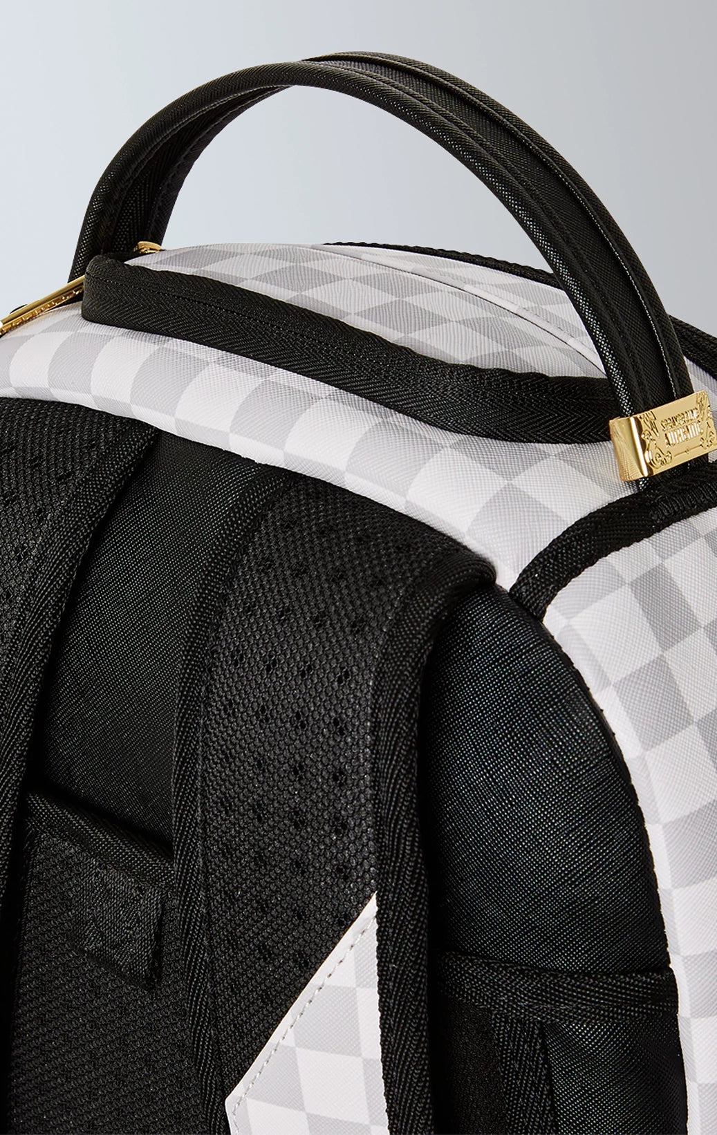 Sprayground Astromane backpack, grey with checkered pattern and laser-cut details. Limited edition.
