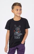 Black Keys Kids Lucky Charm Tee with a black reflective patch. Made from a soft blend of 95% cotton and 5% spandex. Features a crewneck style and a playful lucky charm graphic