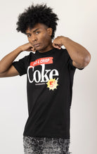 Men's black short-sleeve t-shirt in a classic fit. The shirt features Coca-Cola logos and images screen-printed on both the front and the back.