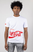 Men's short-sleeve crew neck t-shirt in a variety of colors. The shirt features a Coca-Cola logo graphic on the front. The graphic is heat-sealed and the tee is made from a blend of 94% cotton and 6% spandex.