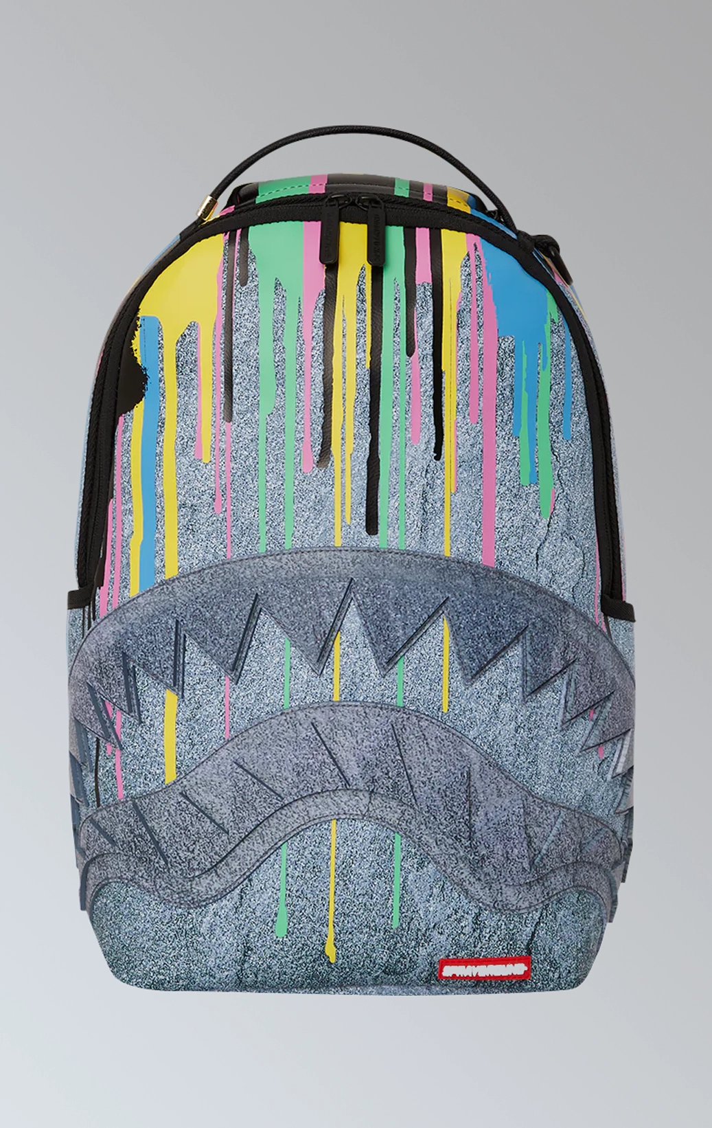 Drippy Stone Shark limited edition backpack from Sprayground that features a unique stone shark design with dripping details.