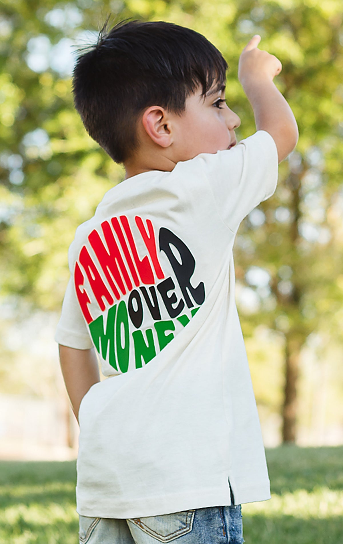 Family over money graphic on back. tee for kids