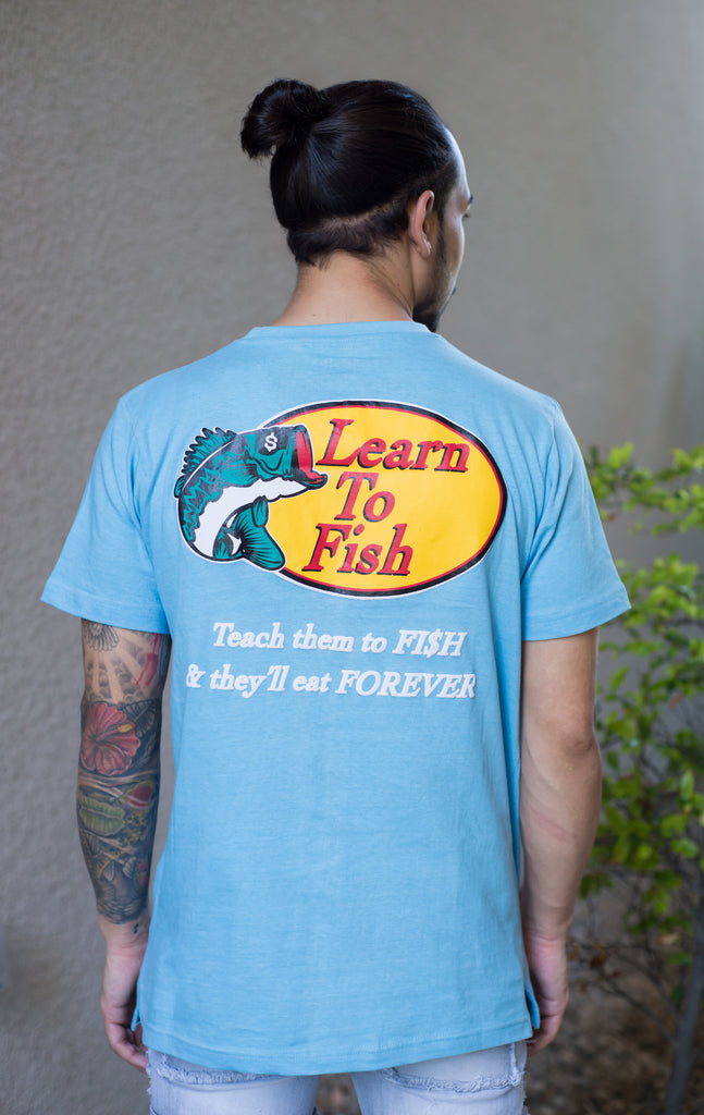 Short sleeve t-shirt with  learn to print logo and "Teach them to fish & they'll eat forever" phrase on the back