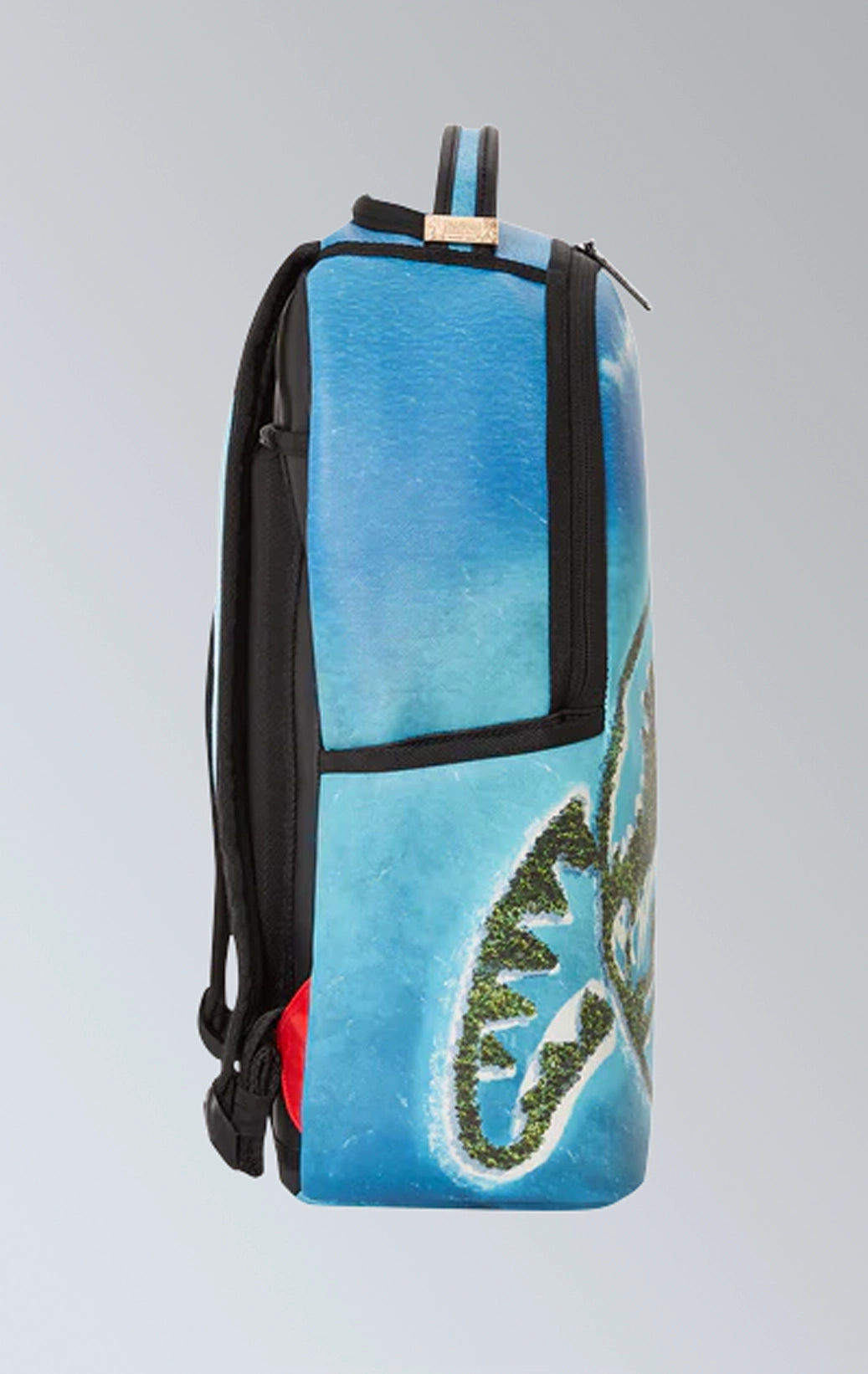 Sprayground backpack with a vibrant Jurassic Island design,
