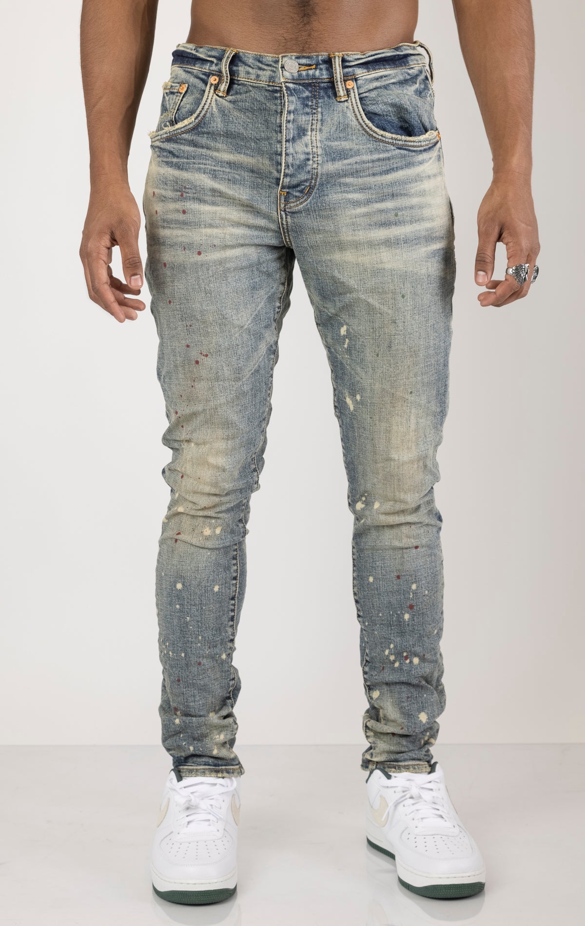 Vintage Spotted Indigo Jeans in dark wash with subtle lighter colored spots. Made from 98% cotton and 2% elastane for comfort. Features include lined back pockets and yoke for comfort and shape retention, reinforced belt loops, and hidden back pocket rive