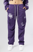White stacked cargo pants in purple