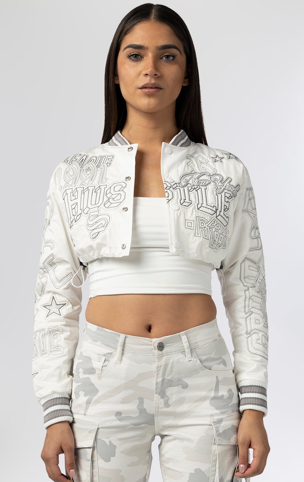 Cropped varsity jacket. Embroidered details on sleeves and back