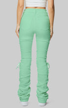 Mint High rise strap bootcut twill pants.