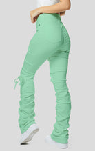 Mint High rise strap bootcut twill pants.