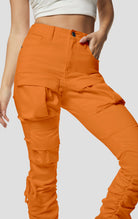 Orange High rise strap bootcut twill pants.