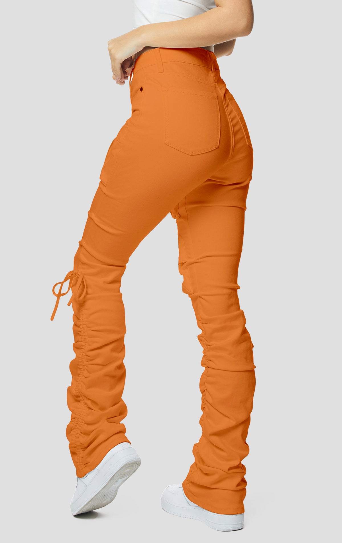 Orange High rise strap bootcut twill pants.