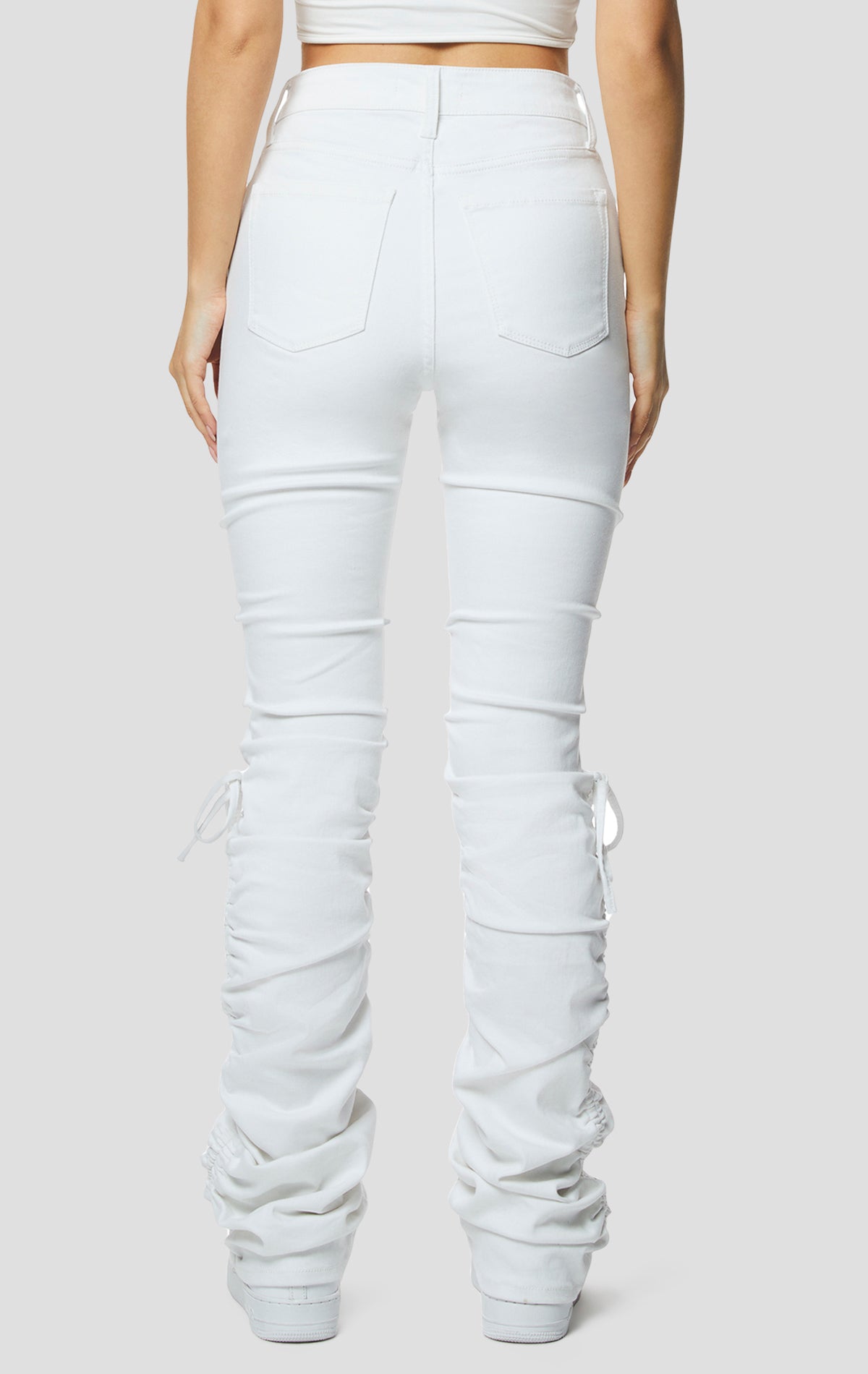 White High rise strap bootcut twill pants.