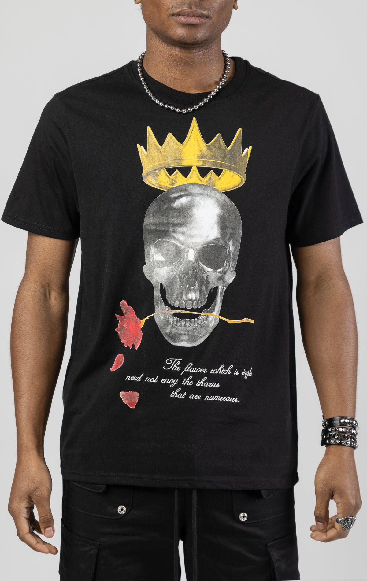 Graphic crewneck t-shirt in black featuring a skull king design on the front.  The shirt is made from a blend of 65% polyester and 35% cotton.
