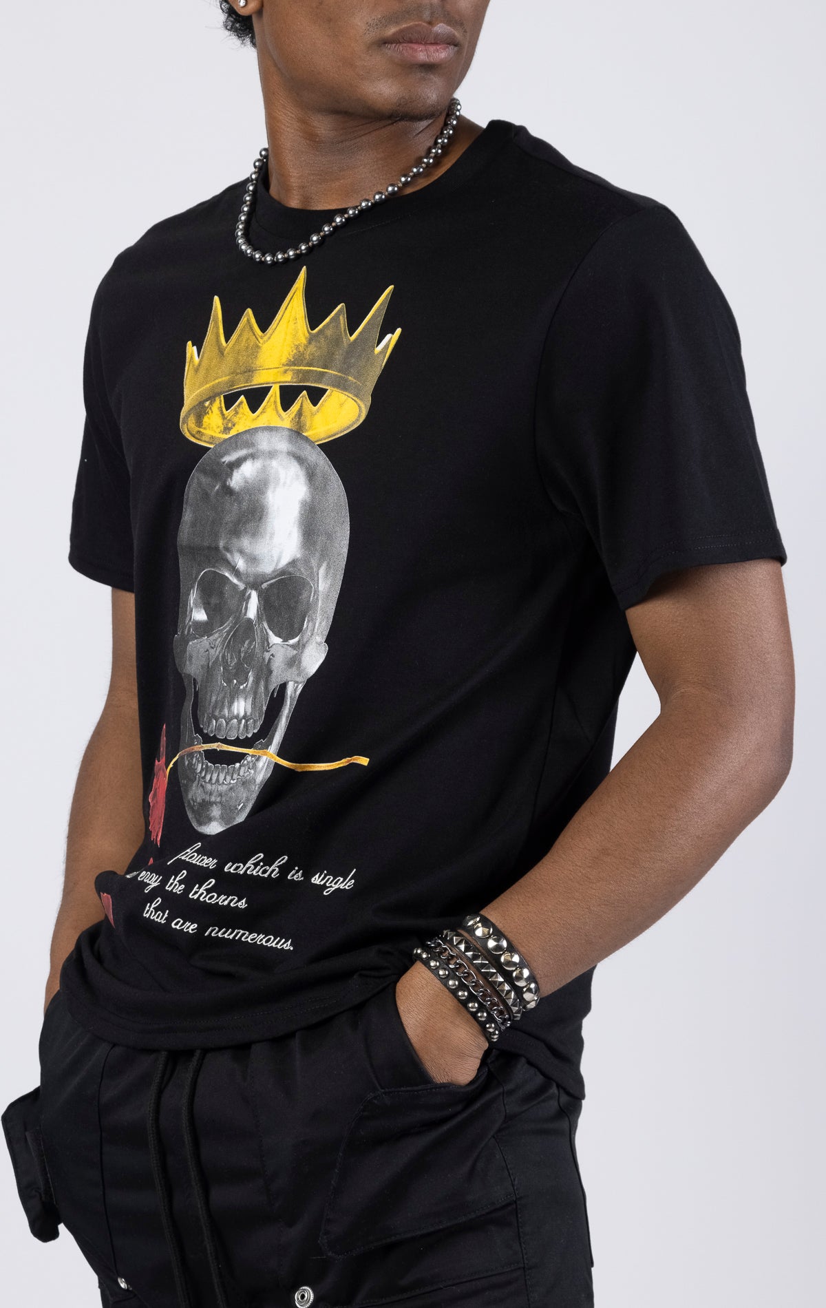 Graphic crewneck t-shirt in black featuring a skull king design on the front. The shirt is made from a blend of 65% polyester and 35% cotton.