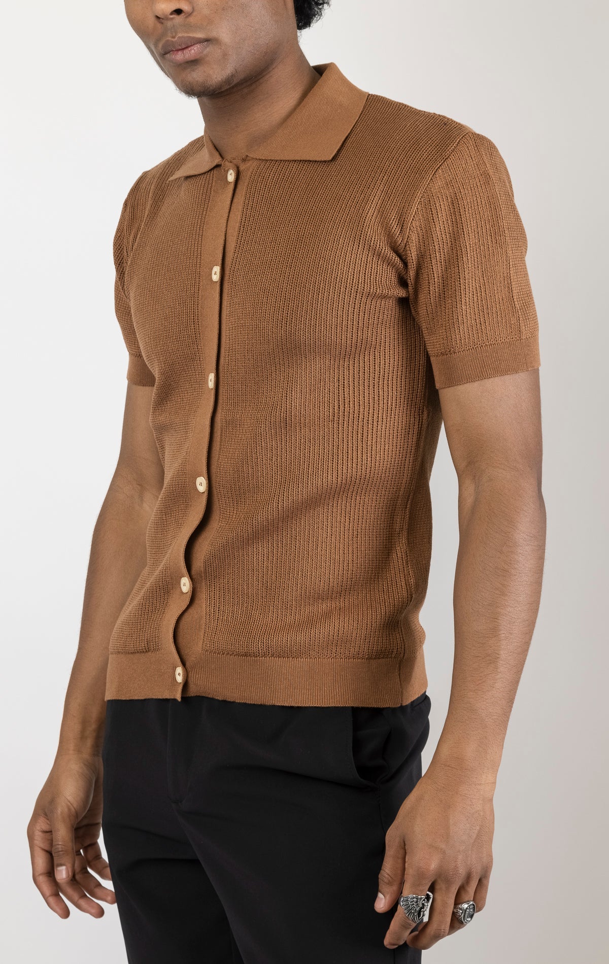 Men's see-through button-down mesh top in brown. The top is made from a 50% cotton, 50% acrylic blend and features a tailored fit with a sheer mesh fabric and button-down closure.