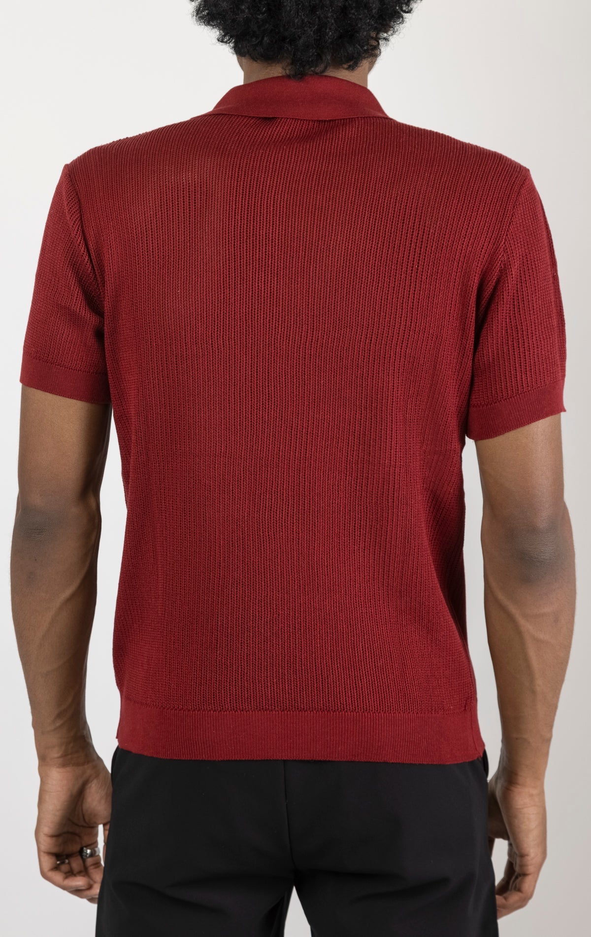 Men's see-through button-down mesh top in burgundy. The top is made from a 50% cotton, 50% acrylic blend and features a tailored fit with a sheer mesh fabric and button-down closure.