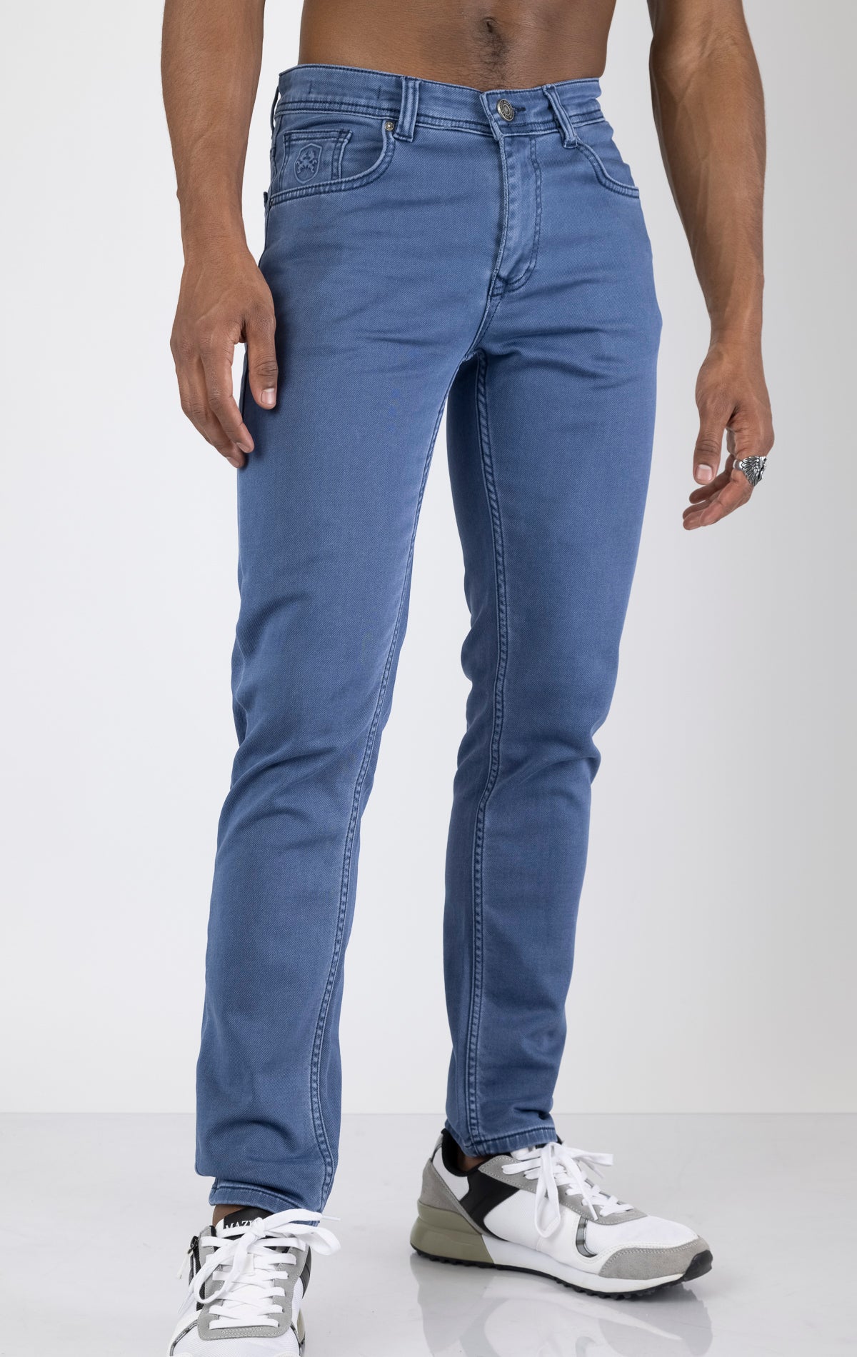 Men's super soft 5-pocket style pants in indigo color. The pants are made from a 98% cotton, 2% elastane blend and feature a tailored fit with a hint of stretch, classic 5-pocket styling (two front pockets, two back pockets, and a coin pocket).