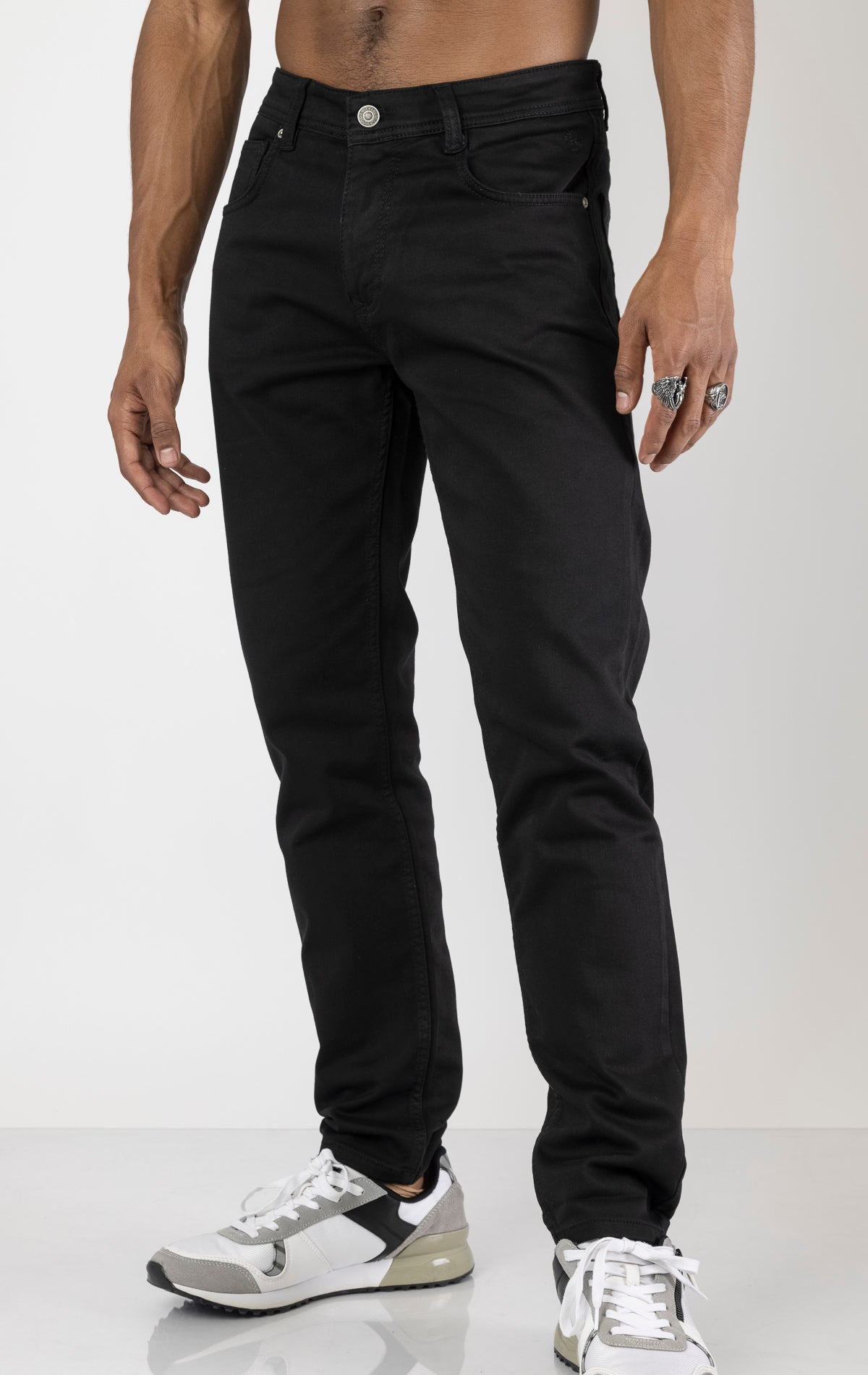 Men's super soft 5-pocket style pants in black color. The pants are made from a 98% cotton, 2% elastane blend and feature a tailored fit with a hint of stretch, classic 5-pocket styling (two front pockets, two back pockets, and a coin pocket).