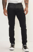 Men's side waxed tapered jeans in black. The jeans are made from premium quality denim (98% cotton, 2% lycra) and feature a tailored fit, meticulously applied waxed detailing along the side seams, and a tapered leg.