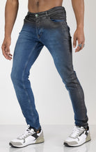 Men's side waxed tapered jeans in blue. The jeans are made from premium quality denim (98% cotton, 2% lycra) and feature a tailored fit, meticulously applied waxed detailing along the side seams, and a tapered leg.