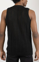 Men's knit muscle fit tank top in black. The tank top is made from a 50% cotton, 50% acrylic blend and features a muscle fit cut, sleeveless construction, and a textured knit fabric.