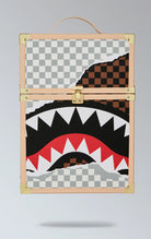 Sprayground square backpack with a large, all-over print of a shark in a checkerboard pattern, inspired by the ancient Indian board game Chaturanga