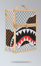 Sprayground square backpack with a large, all-over print of a shark in a checkerboard pattern, inspired by the ancient Indian board game Chaturanga