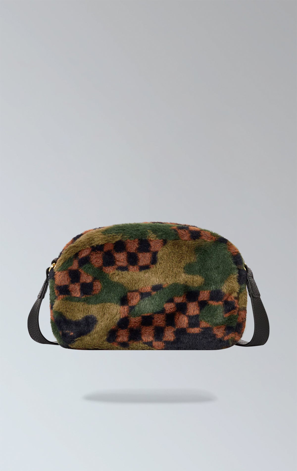 Sprayground camouflage crossbody bag with faux fur details, featuring two zippered compartments, a side handle, gunmetal zippers with metal hardware, a water-resistant interior pocket, and easy-to-clean nylon fabric. Made from durable water-resistant faux leather.