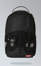 Black Sprayground backpack with the eye-catching Velcro 3 Sharks design. Features multiple compartments including a separate velour laptop compartment, side pockets, and a hidden zippered pocket. Equipped with ergonomic mesh back padding, adjustable straps, and a sliding back sleeve for attaching to carry-on luggage. Made from durable vegan leather.