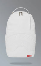 White Sprayground backpack with a unique scribble design. Features multiple compartments including a separate velour laptop compartment, side pockets, and a hidden zippered pocket. Equipped with ergonomic mesh back padding, adjustable straps, and a sliding back sleeve for attaching to carry-on luggage. Made from durable vegan leather.