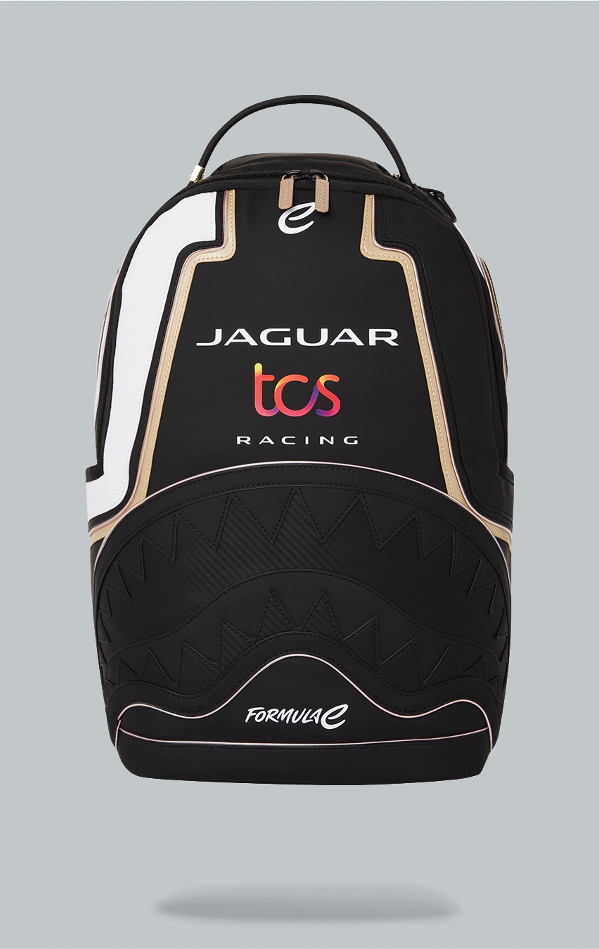 Sprayground x Formula E Jaguar backpack with built-in LED lights. Black water-resistant PVC backpack with Formula E Jaguar design. Includes laptop compartment, organizer pocket, and USB cable for charging. Note: Lithium battery inside, check with airline 