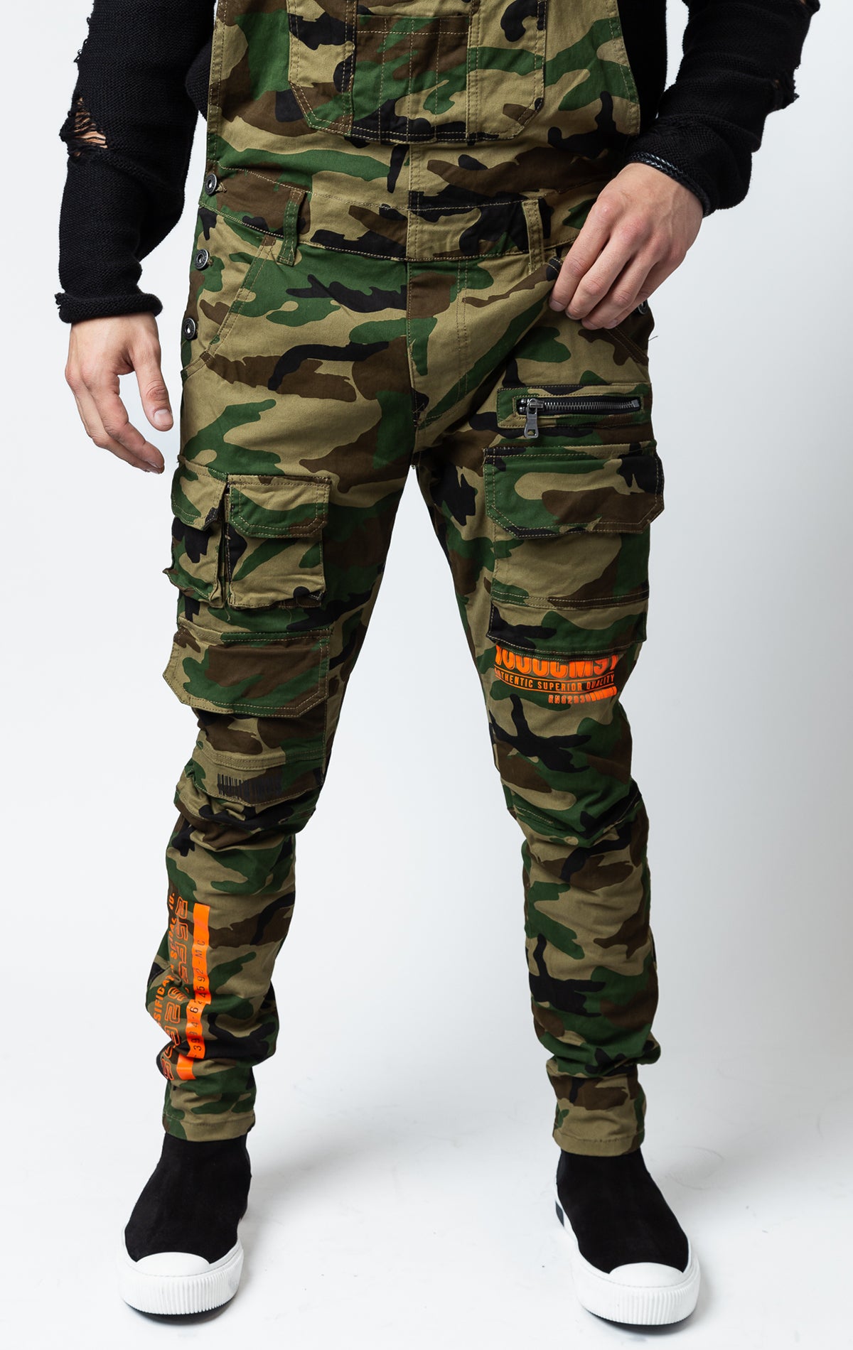 Camo Cotton twill overalls with cargo pockets and adjustable shoulder straps.