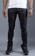 Black Glossy denim with a regular rise, flared stacked jeans