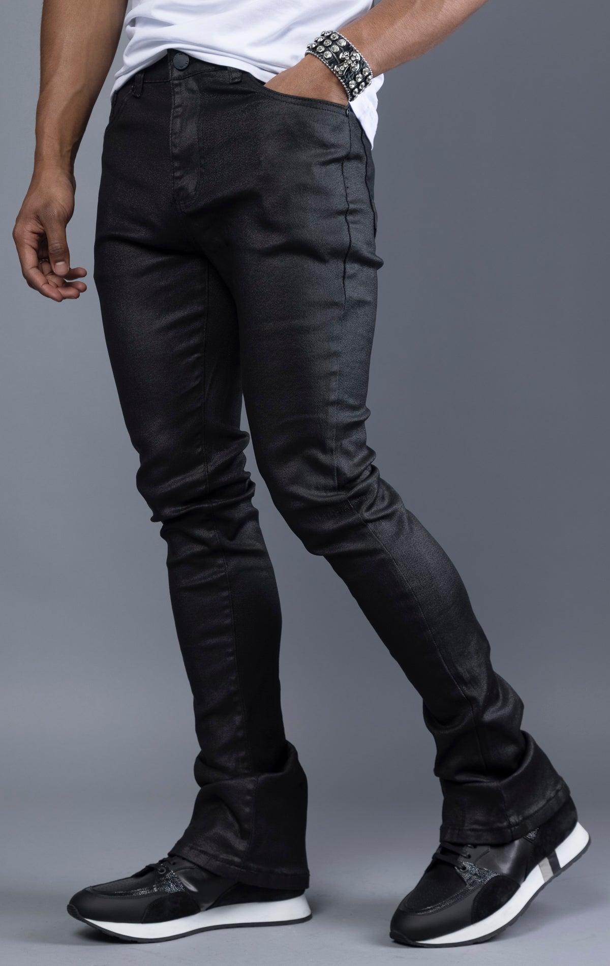 Black Glossy denim with a regular rise, flared stacked jeans