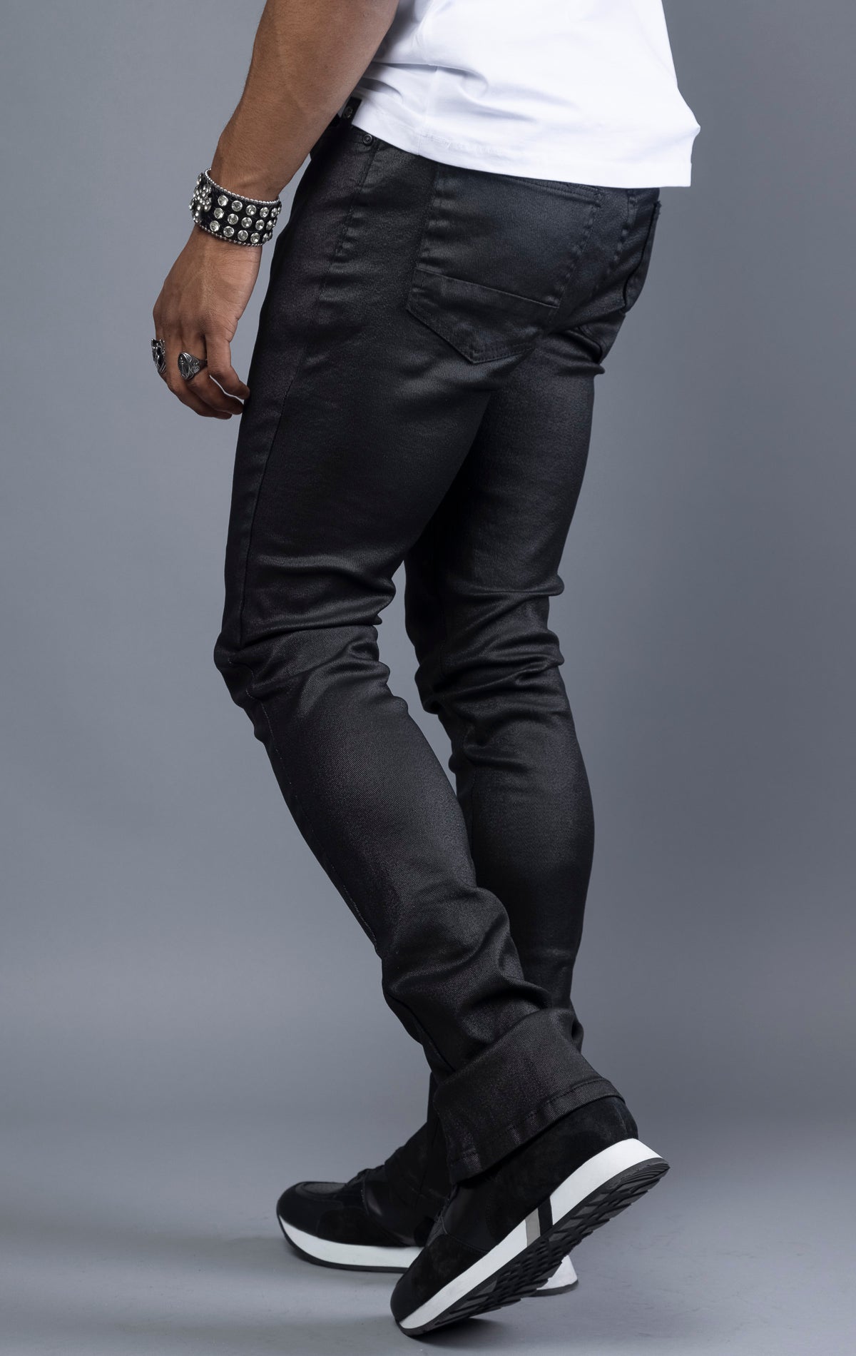 Black Glossy denim with a regular rise, flared stacked jeans