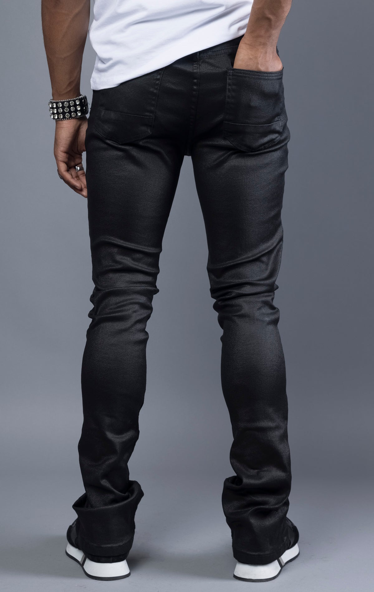 Black Glossy denim with a regular rise, flared stacked jeans