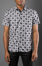 Men's casual, relaxed-fit button-down shirt with a short sleeve design. The shirt features an all-over Greek key pattern and a front button closure.